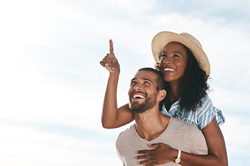 Image showing Sky, piggyback and happy couple pointing at space with nature on romantic summer holiday travel and mockup. Love, man and woman on adventure with happiness on date, romance and vacation together.