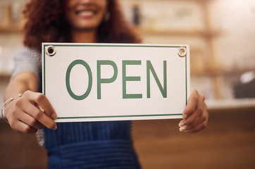 Image showing Open sign, hands and woman in small business, store and advertising news of retail shopping time, banner and trading information. Closeup, shop owner and board for opening, welcome and cafe signage