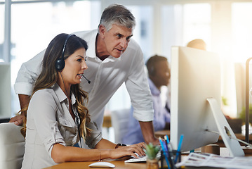 Image showing Leadership, woman or senior manager in call center training telemarketing in customer services office. Contact us, coaching or mature mentor teaching an insurance agent on new job advice on computer