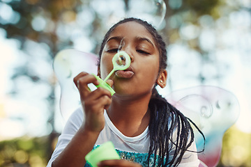 Image showing Nature, princess costume and girl with bubble for playing fantasy, childhood games and happiness. Forest, fairy tale and face of African child in woods blowing bubbles for adventure, magic and fun