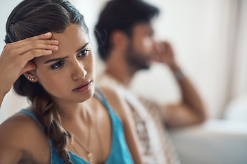 Image showing Unhappy, upset or sad with a couple arguing on a sofa in their home living room about an affair or breakup. Depression, abuse or domestic violence with a woman thinking about divorce after a fight