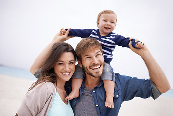 Image showing Family, airplane and baby with parents at a beach for piggyback, fun and walking in nature. Love, kid and happy woman with man outdoors bonding, smile and relax while enjoying travel, freedom or game