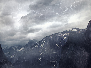 Image showing Rain, mountain and landscape with a storm, nature and bad weather with lighting, environment and forest. Trees, thunder and hills with water, grey sky and winter with ecology, hurricane and natural