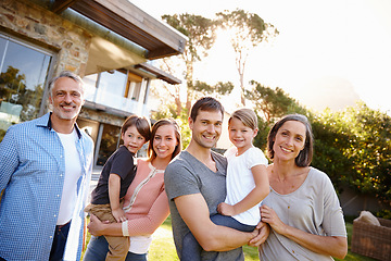 Image showing Love, portrait of happy family at their home and outdoors together on lawn. Excited or happiness, care or bonding time for relationships and cheerful people in backyard of their house bonding