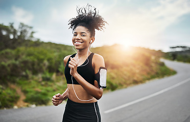 Image showing Sports, portrait and happy woman running in road with music earphones, workout or cardio routine. Smile, exercise and face of female runner in nature with podcast for training, energy and fitness