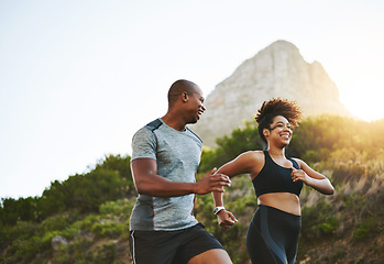 Image showing Sports, workout and couple walking by a mountain training for a race, marathon or competition. Fitness, nature and athletes doing an outdoor cardio exercise for health, energy and endurance at sunset