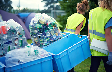 Image showing Recycling, community service and volunteer work outdoor with cans and garbage at a park. Cleaning, sustainability and bottle recycle with people helping with rubbish and pollution for environment