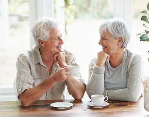 Image showing Happy senior couple, coffee and smile for morning breakfast, relationship or bonding together at home. Elderly man and woman smiling with drinking tea cup or mug in relax, conversation or retirement