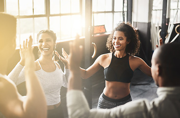 Image showing High five, funny and teamwork of friends in gym for fitness, team building and solidarity. Collaboration, group of people and celebration for exercise targets, goals or support, motivation or success