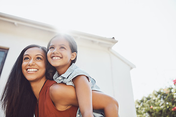 Image showing Love, piggyback and happy mother playing with her child in the garden of the backyard of their home. Happiness, smile and young woman or mom having fun with her girl kid outdoor of their family house