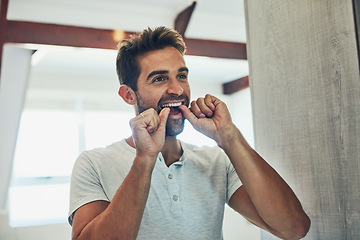Image showing Dental, floss and teeth with man in bathroom mirror for cleaning, morning routine and oral hygiene. Smile, cosmetics and health with male person flossing at home for self care, breath and mouth