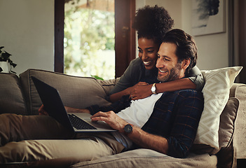 Image showing Laptop, subscription and an interracial couple watching a movie using an online streaming service for entertainment. Computer, relax or internet with a man and woman bonding together over a video