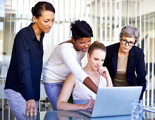 Image showing Business, employees and women with a laptop, brainstorming and teamwork at the workplace. Female consultants, agents and workers share ideas, technology and startup with collaboration and innovation