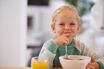 Image showing Portrait, morning and a child eating breakfast with happiness, hungry and smile at a home table. Happy, young and a little girl smiling for food, cereal and enjoying a meal for nutrition in a house