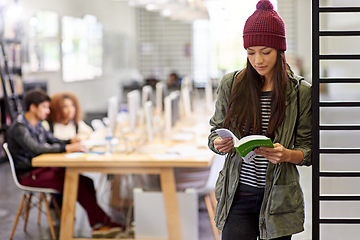 Image showing Woman, student in library reading book and study for exam or research for project on university campus. Education, learning and academic development with female person holding textbook for knowledge