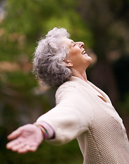 Image showing Happiness, senior woman with open arms enjoying life outdoors or success, happy and retired lady celebration of financial freedom. Healthy, smiling pensioner stretching with joy in retirement