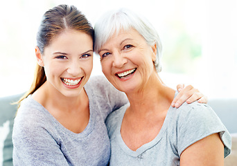 Image showing Happiness, portrait woman and senior mother on sofa, bonding and healthy relationship in living room. Smile on face, mom and daughter on couch, love and quality time to relax together in family home.