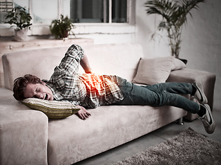 Image showing Man, back pain or injury on home sofa while crying, burnout or muscle and health problem. Male person massage red anatomy glow for arthritis, spine accident and emergency or backache on a couch