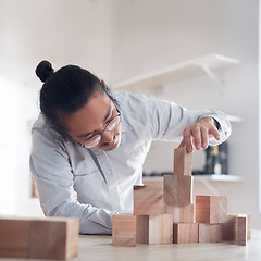 Image showing Man, office and building block game, thinking challenge and design innovation for balance and construction. Engineering, architecture and Japanese designer with wood blocks for problem solving games.