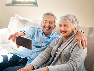 Image showing Senior couple, selfie and happy on couch in retirement for social media, blog or post on internet. Elderly man, woman and photography for profile picture on app, web or smile together on lounge sofa