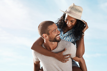 Image showing Happy couple, blue sky and piggyback in nature on romantic summer adventure holiday with travel on mockup space. Love, man and woman outdoor with happiness on date, smile and vacation together.