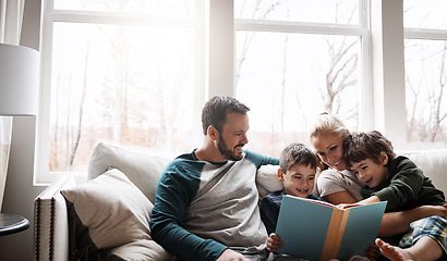 Image showing Family, reading book with parents and children, happiness at home with story time and learning. Love, relationship and happy people bonding and care in living room with education and development