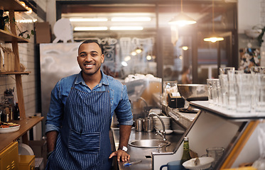 Image showing Coffee shop, restaurant and happy portrait of man for service, working and welcome in cafe. Small business owner, bistro startup and male worker, waiter of barista smile by counter ready to serve