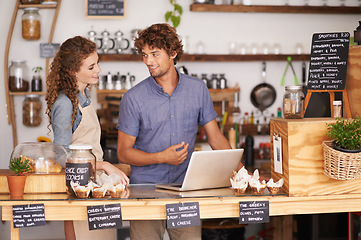 Image showing Coffee shop, laptop and partnership as small business owner talking, planning and working together. Man and woman as barista, manager or waiter in restaurant with technology for service and training