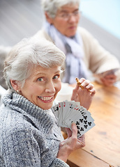 Image showing Happy, portrait and old people playing cards at a nursing home for happiness, recreation and game. Smile, showing and a senior woman with a win in poker, excited and bonding with friends in games