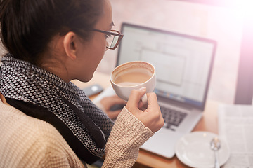 Image showing Coffee, woman and laptop for remote work in cafe or coffee shop. Networking, female student or businesswoman with mobile device and newspaper in restaurant with hot beverage for copywriting.