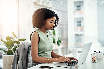 Image showing Business, typing and black woman with a laptop, connection and search internet for website details, information and focus. Female person, entrepreneur and employee with a pc, technology and email