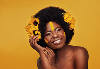 Image showing Makeup, sunflower and portrait of black woman in studio for beauty, creative or spring. Natural, cosmetics and floral with face of model isolated on yellow background for art, self love or confidence