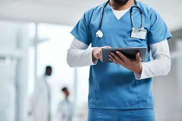 Image showing Hospital, doctor hands and tablet with a man in a clinic reading healthcare and wellness data. Employee, nurse and Male person with digital and health results on technology with research analysis