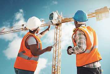 Image showing Construction, engineering and team with tablet and crane for building project, teamwork or architecture. Black woman and man manager talking outdoor for engineer planning, vision or safety inspection