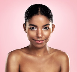 Image showing Portrait of woman, skincare and face on pink background, studio and clean dermatology results. Happy african, female model and natural beauty with confidence, glowing skin and aesthetic cosmetics