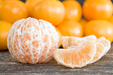 Image showing juicy fresh slices of ripe and sweet oranges on the table