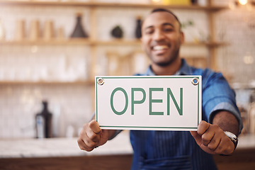 Image showing Closeup of open sign, man and owner of shop, store and advertising notice of retail trading time, services and information. Hands of happy cafe worker with opening banner, welcome and startup poster