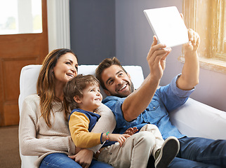 Image showing Selfie, tablet and happy family relax in a home together doing social media content on the internet or online. App, website and parents with kid or child in happiness and smile for a picture