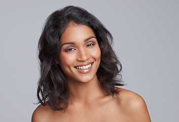 Image showing Portrait, beauty and hair with a woman in studio on a gray background for natural haircare treatment. Face, skincare and shampoo with an attractive young female model at the salon for a haircut