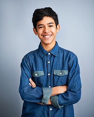 Image showing Smile, happy and portrait of teenager with fashion feeling confident arms crossed isolated in a gray studio background. Content, happiness and young Arab teen male person or teen with style