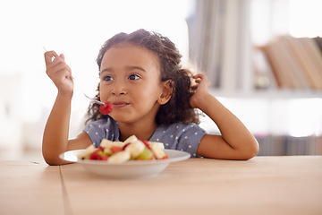 Image showing Eating child, breakfast and fruit salad at home with happiness and wellness meal with a smile. House, nutrition and young girl with healthy food and fruits of a hungry kid in the morning at a table