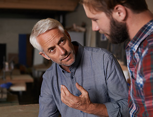 Image showing Teaching, father and son in a workshop, discussion and skills with development, growth and bonding. Family, parent and dad with grown up child, planning and lesson with guidance, startup and talking