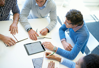 Image showing Hands, group and tablet in top view for teamwork, business people or plan strategy together in workplace. Team building, touchscreen or analysis for idea, brainstorming or problem solving in office