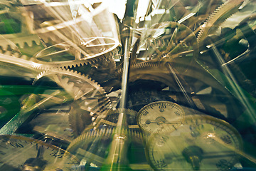 Image showing Machinery, closeup and inside a clock with parts for creative, design and time piece in a workshop. Abstract, zoom and vintage objects or parts of a watch, mechanics and metallic detail in production