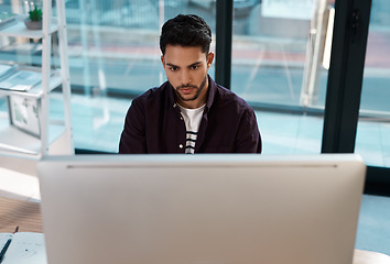 Image showing Computer, business and a serious man working at a desk while online for research work on website. Male entrepreneur person with focus and internet connection for banner project or reading email