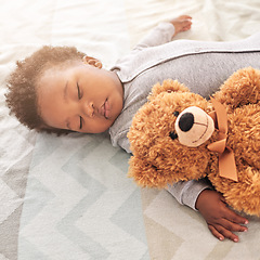 Image showing Sleeping, teddy bear and cute with baby in bedroom for carefree, development and innocence. Dreaming, relax and comfortable with african infant and toy at home for morning, resting and bedtime