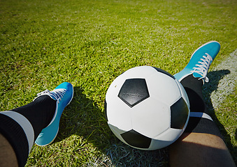 Image showing Sport, field and shoes of man with soccer ball outdoor, relax and resting after fitness or training. Football, pov and male player relaxing on grass at park after workout, match or sports performance