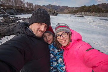 Image showing Family selfie at winter journey.