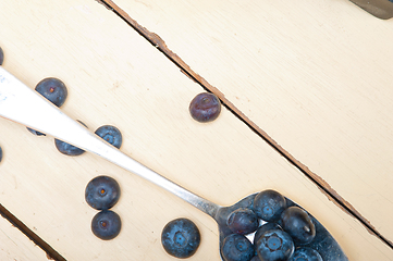 Image showing fresh blueberry on silver spoon