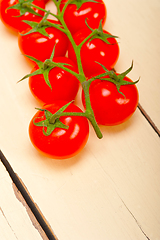 Image showing fresh cherry tomatoes on a cluster